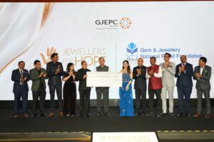 Rahul Narwekar, Madhuri Dixit and GJEPC industry leaders at Jewellers for Hope 2026 charity event in Mumbai.
