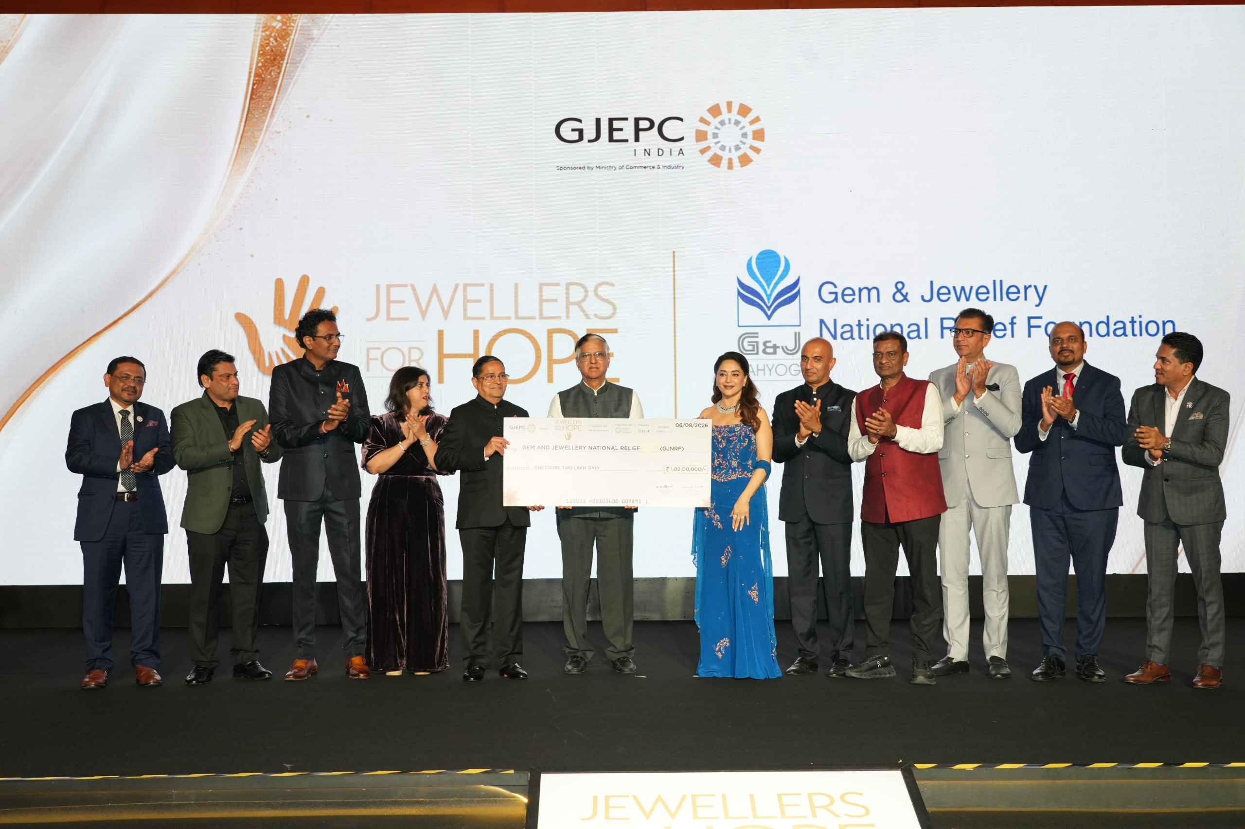 Rahul Narwekar, Madhuri Dixit and GJEPC industry leaders at Jewellers for Hope 2026 charity event in Mumbai.