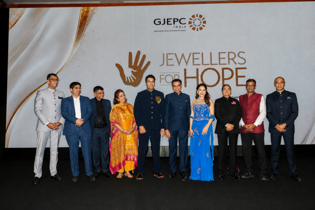 Rahul Narwekar, Madhuri Dixit and GJEPC industry leaders at Jewellers for Hope 2026 charity event in Mumbai.