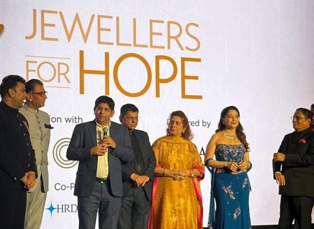 Rahul Narwekar, Madhuri Dixit and GJEPC industry leaders at Jewellers for Hope 2026 charity event in Mumbai.