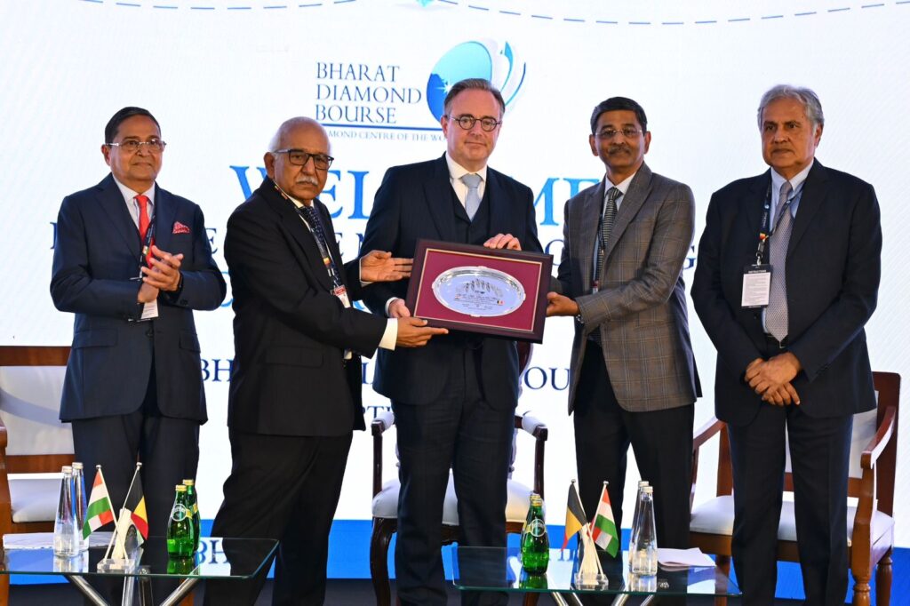 Belgian PM Bart De Wever receives a memento from Bharat Diamond Bourse officials